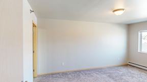A room with a door and a window.