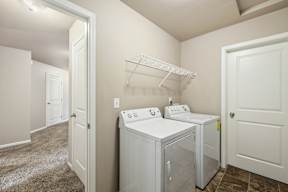 A laundry room with a washer and dryer.