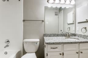 a bathroom with a sink toilet and bathtub