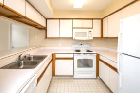 Kitchen with Sink, Stove, Microwave, Refrigerator