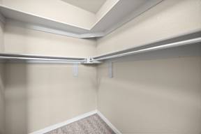 A room with a carpeted floor and a white ceiling.