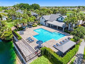 A large house with a pool in the backyard.