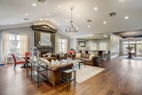 a large living room with couches and a table with chairs