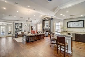 a large living room with a kitchen and a dining room