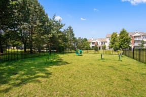 Dog-Friendly Apartments in Naperville, IL - 803 Corday at Naperville - Gated Dog Agility Park with Lush Landscapes and Trees.