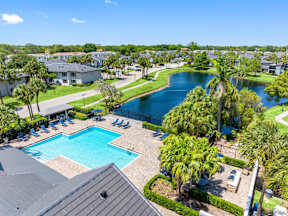 A view of a pool and a lake from a high angle.