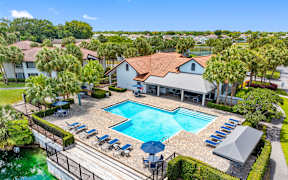 A large house with a pool in the backyard.