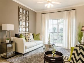 Apartments for Rent in Franklin - Harpeth River Oaks - Living Room with Patio Entrance, Ceiling Fan, and Area Rug