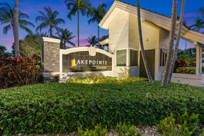 a building with a sign that says lake pointe apartments