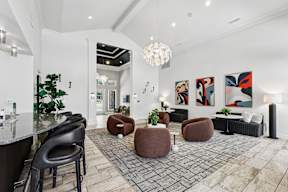 A modern living room with a black and white color scheme.