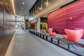 Lobby with red wall and seating