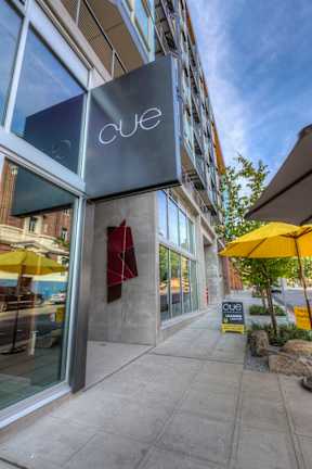Cue entrance with building sign