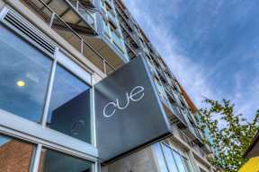 Cue entrance with building sign