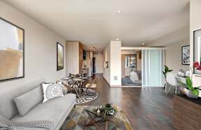 Living room with bedroom in background