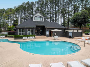 a swimming pool in front of a house