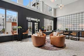 A modern living room with a large window and a view of the city.
