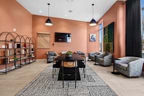 A modern living room with a dining table and chairs.