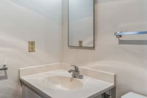 a bathroom with a sink and a mirror