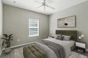 A bedroom with a large bed and a ceiling fan.