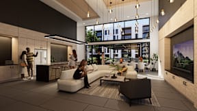 A modern living room with people sitting and standing around.