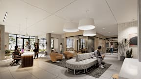 A modern living room with people sitting and standing around.