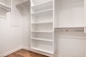 Empty white shelves in a room.