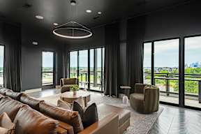 A modern living room with a view of the city.