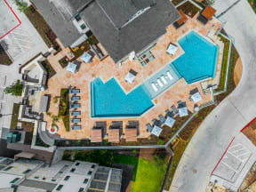 arial view of a swimming pool on top of a property