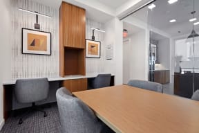 a conference room in an office space with a table and chairs