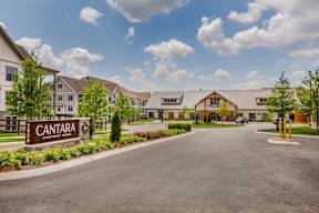 The image shows a large building with the name "Cantara" on a sign in front of it.