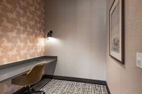 A room with a desk and a chair.