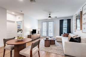 A modern living room with a dining table and a couch.