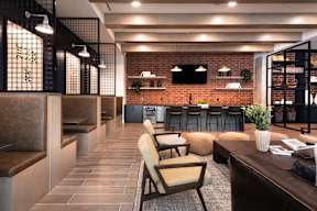A modern interior with a brick wall and a bar area.