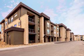 Apartment building with brown and beige exterior.