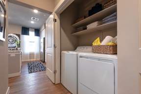 A laundry room with a washer and dryer.