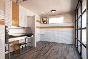 A kitchen with a grill and a window.