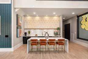 Clubhouse lounge with island seating and kitchenette at Finley on the Green.