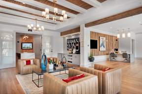 A modern living room with a wooden floor and a large window.