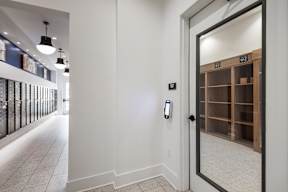 A white door with a black handle and a black lock.