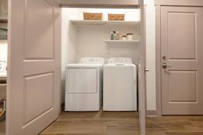 A laundry room with a washer and dryer.