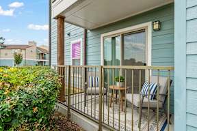 Nichols Park Apartments in South Austin - photo of a cozy balcony with a chair and a table.