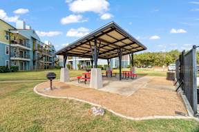 A park with a pavilion and benches.