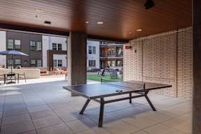 A table is in the middle of a patio.