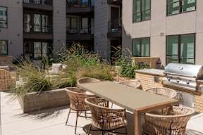 A table and chairs set up on a patio.