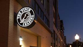 The Finch Lending logo is displayed on a building.