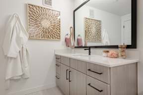 A bathroom with a white towel hanging on the wall.