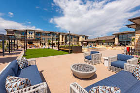 A sunny day at the outdoor seating area of a modern building.