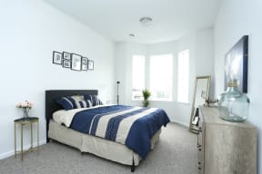 Bedroom model units with carpeted floors white walls