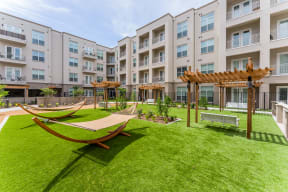 Courtyard with hammocks at Residences at 3000 Bardin Road, Grand Prairie, TX