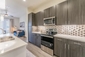 Kitchens With High-Quality Countertops at Residences at 3000 Bardin Road, Grand Prairie, TX, 75052
